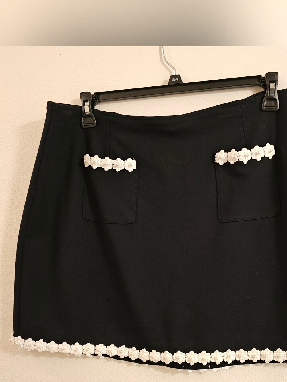 CeCe Black Mini Skirt with White Floral Crochet W/pearl Center Of Trim